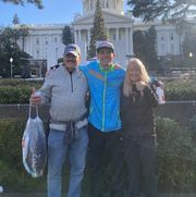 riley cook after the california international marathon with his parents