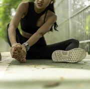 top of foot pain running woman got sport injured while jogging on the street